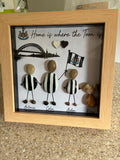 Personalised Newcastle United family pebble art frame with Tyne Bridge skyline and black and white striped pebble people