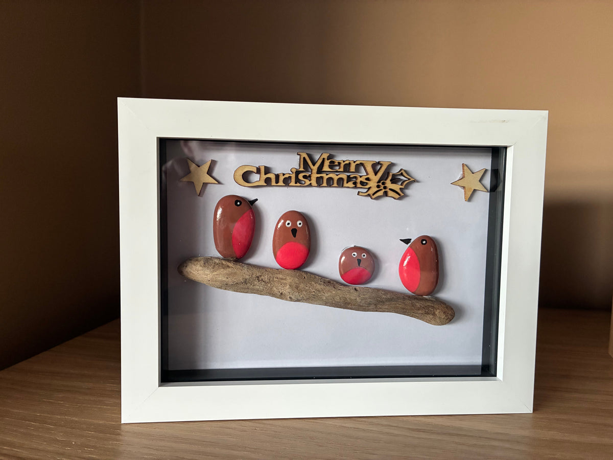 Robin family pebble art on driftwood with Merry Christmas sign