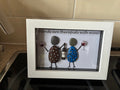 Two painted leopard print pebble friends holding wine glasses with bottle, friends are therapists with wine quote frame