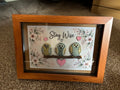 Stay Wise owl pebble art shadow box frame with three hand-painted pebble owls on a twig, surrounded by floral illustrations and pink hearts