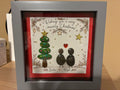 Personalised Christmas pebble art couple frame with names Linda and Nigel, featuring a pebble Christmas tree and heart